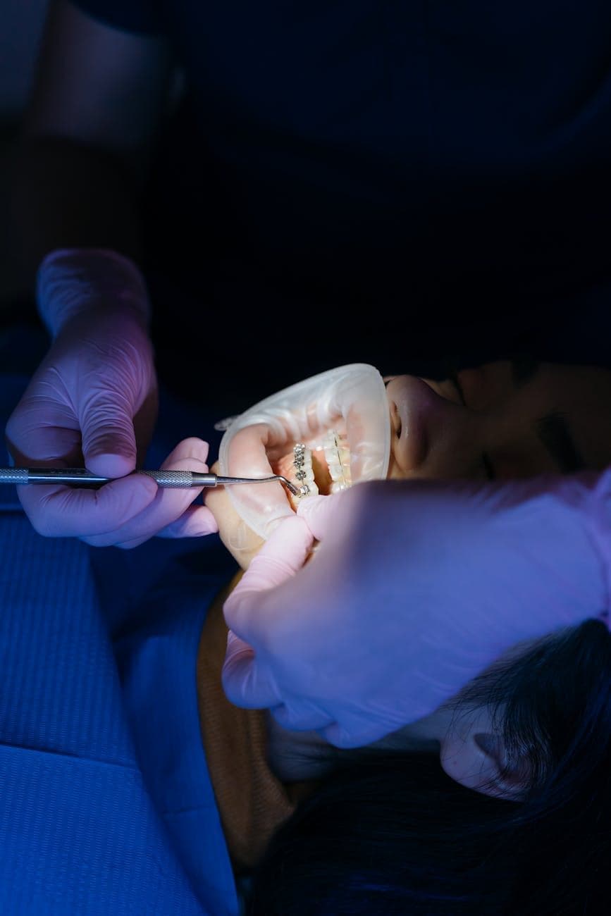 A clinician checking a restoration chairside.
